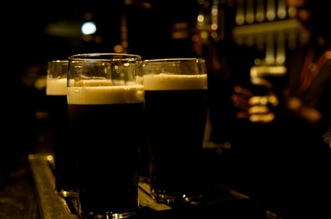 Pint of stout beer served in two time