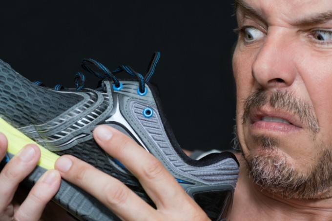 man disgusted by smell of trainers